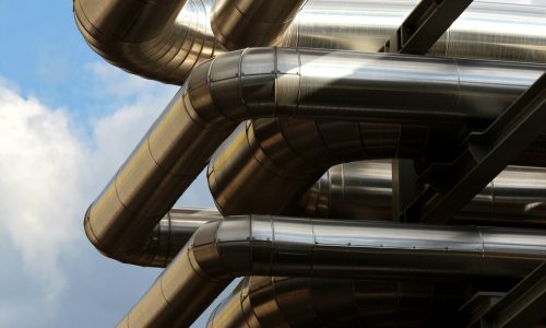 metal oil pipe in refinery under sky